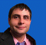 A person in a suit and tie

AI-generated content may be incorrect.